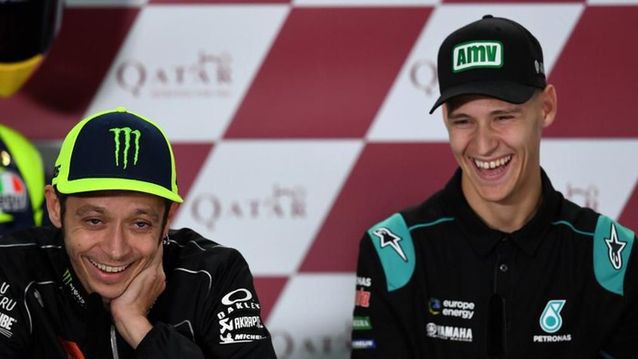 Yamaha MotoGPs Valentino Rossi of Italy (L) and Petronas Yamaha SRTs Fabio Quartararo attend a press conference at Losail Circuit in Doha on March 7, 2019, ahead of the seasons start at Qatar MotoGP grand prix on March 10. (Photo by GIUSEPPE CACACE / AFP)