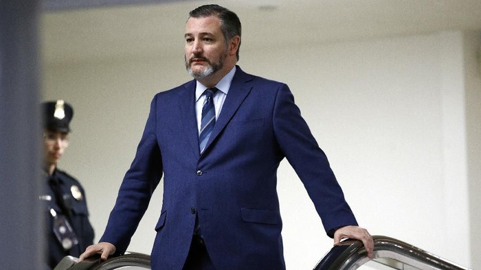 FILE - In this Jan. 29, 2020, file photo, Sen. Ted Cruz, R-Texas, rides an escalator before speaking with reporters on Capitol Hill in Washington. GOP Sen. Cruz said Sunday, March 8, 2020, he will remain at his home in Texas after learning that he shook hands and briefly chatted with a man in suburban Washington who has tested positive for coronavirus. (AP Photo/Patrick Semansky, File)