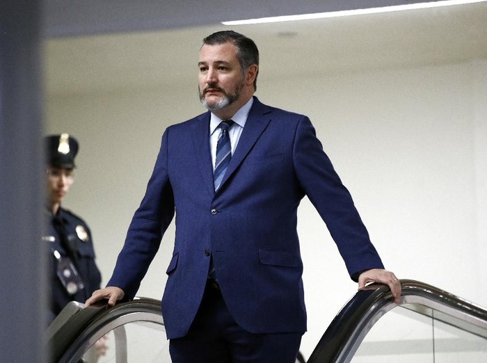 FILE - In this Jan. 29, 2020, file photo, Sen. Ted Cruz, R-Texas, rides an escalator before speaking with reporters on Capitol Hill in Washington. GOP Sen. Cruz said Sunday, March 8, 2020, he will remain at his home in Texas after learning that he shook hands and briefly chatted with a man in suburban Washington who has tested positive for coronavirus. (AP Photo/Patrick Semansky, File)