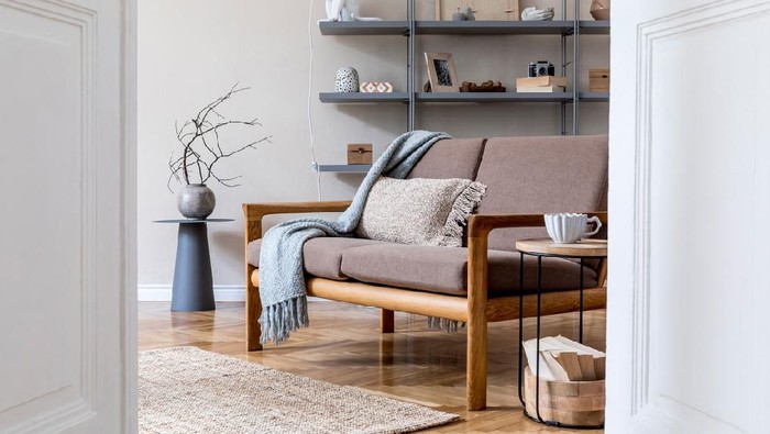 Room with cozy light decorated in Scandinavian style, using natural materials.