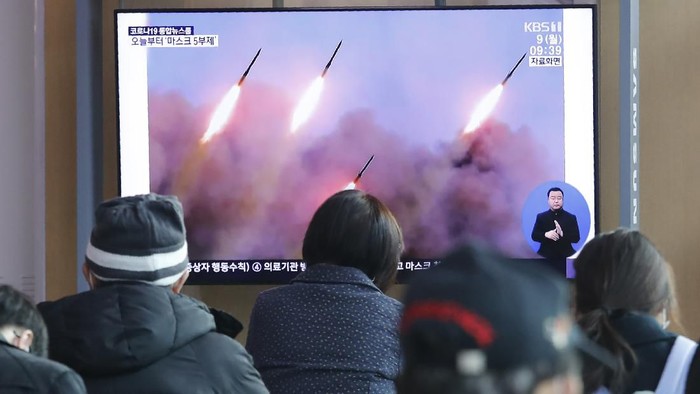 People watch a TV showing file images of North Koreas missile launch during a news program at the Seoul Railway Station in Seoul, South Korea, Monday, March 9, 2020. North Korea fired three unidentified projectiles off its east coast on Monday, South Koreas military said, two days after the North threatened to take 