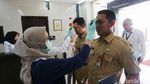 Pemeriksaan Suhu Tubuh di Kemenko PMK
