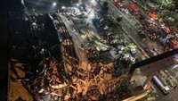Hotel Xinjia ambruk pada Sabtu (7/3/2020) sekitar pukul 19.30. Hotel itu digunakan untuk menampung orang-orang yang sempat melakukan kontak dengan pasien positif Corona. STR/AFP.