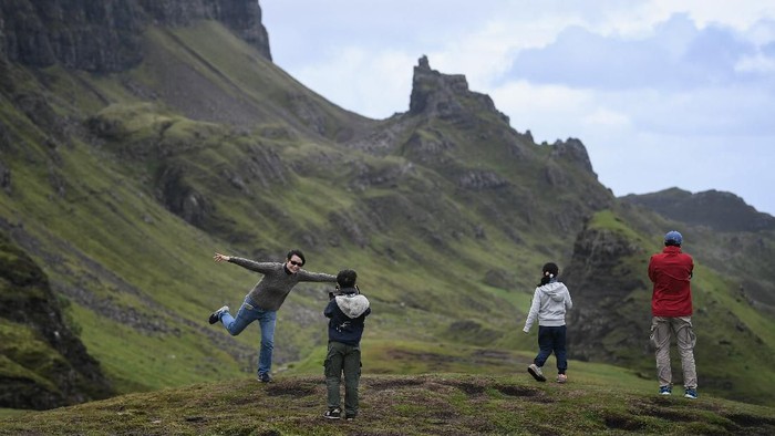 STAFFIN, SCOTLAND - AUGUST 17:  Tourist visit the Quiraing on the Isle of Skye on August 17, 2017 in Staffin, Scotland. The Isle of Skye is known as one of the most beautiful places in Scotland, however its infrastructure services are being stretched to the limit by the number of visitors heading there to enjoy its rugged scenic beauty.  (Photo by Jeff J Mitchell/Getty Images)