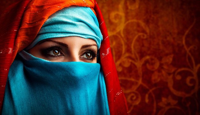 Fashion portrait of a Muslim woman wearing the hijab and looking at the camera