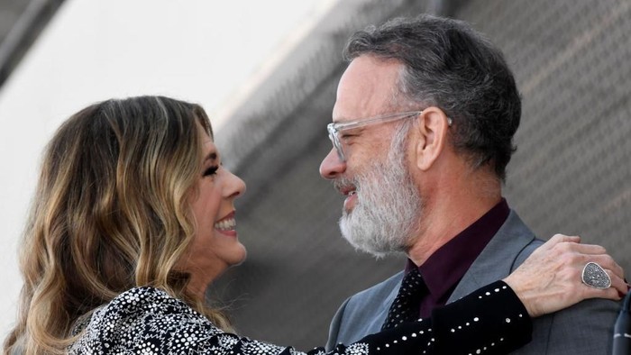 HOLLYWOOD, CALIFORNIA - MARCH 29: Rita Wilson and Tom Hanks embrace as Wilson is honored with a star on the Hollywood Walk of Fame on March 29, 2019 in Hollywood, California. (Photo by Frazer Harrison/Getty Images)