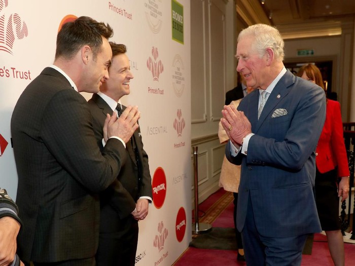 LONDON, ENGLAND - MARCH 11: Prince Charles, Prince of Wales uses the Namaste gesture to greet television presenters Ant McPartlin (L) and Declan Donnelly as he attends the Princes Trust And TK Maxx & Homesense Awards at London Palladium on March 11, 2020 in London, England. (Photo by Yui Mok - WPA Pool/Getty Images)