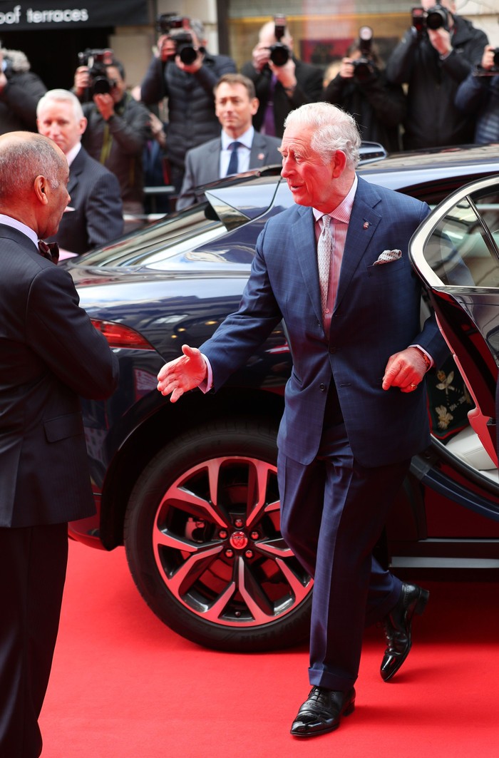 LONDON, ENGLAND - MARCH 11: Prince Charles, Prince of Wales goes to shake the hand of Sir Kenneth Olisa, The Lord-Lieutenant of Greater London (left) before he changes to use a Namaste gesture, as he arrives at the annual Prince's Trust And TK Maxx & Homesense Awards at London Palladium on March 11, 2020 in London, England. (Photo by Yui Mok - WPA Pool/Getty Images)