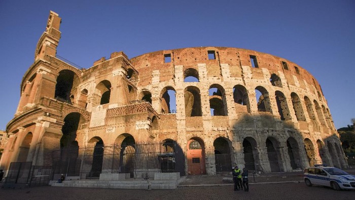 A view of the Colosseum that will be closed following the governments new prevention measures on public gatherings, in Rome, Sunday, March 8, 2020. Italy announced a sweeping quarantine early Sunday for its northern regions, igniting travel chaos as it restricted the movements of a quarter of its population in a bid to halt the new coronavirus relentless march across Europe. (AP Photo/Andrew Medichini)