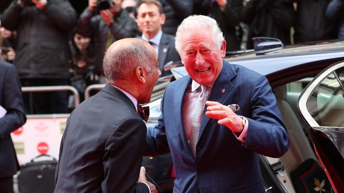 LONDON, ENGLAND - MARCH 11: Prince Charles, Prince of Wales goes to shake the hand of Sir Kenneth Olisa, The Lord-Lieutenant of Greater London (left) before he changes to use a Namaste gesture, as he arrives at the annual Princes Trust And TK Maxx & Homesense Awards at London Palladium on March 11, 2020 in London, England. (Photo by Yui Mok - WPA Pool/Getty Images)
