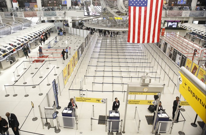 The area for TSA screening of travelers at JFK airports Terminal 1 is relatively empty, Friday, March 13, 2020, in New York. The coronavirus outbreak is hitting the airline industry hard. President Trump banned most Europeans from entering the Unite