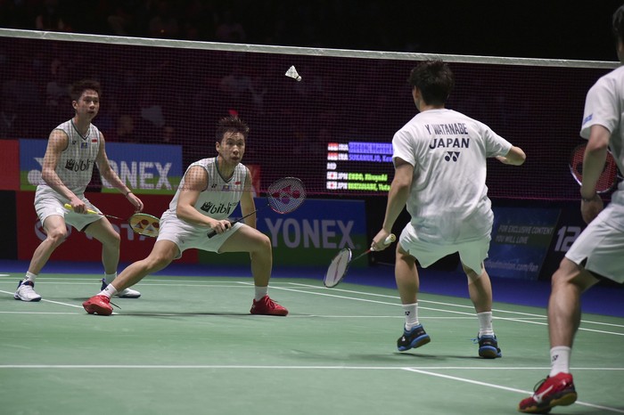 Kevin Sanjaya Sukamuljo, left, and Marcus Fernaldi Gideon of Indonesia play Hiroyuki Endo, right, and Yuta Watanabe of Japan during the Mens Doubles final match at the All England Open Badminton tournament in Birmingham, England, Sunday, March 15, 2020. (AP Photo/Rui Vieira)