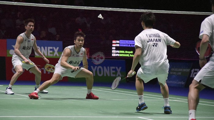 Kevin Sanjaya Sukamuljo, left, and Marcus Fernaldi Gideon of Indonesia play Hiroyuki Endo, right, and Yuta Watanabe of Japan during the Mens Doubles final match at the All England Open Badminton tournament in Birmingham, England, Sunday, March 15, 2020. (AP Photo/Rui Vieira)