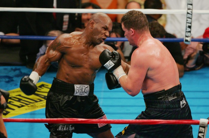 WALSALL, UNITED KINGDOM - NOVEMBER 18:  Former world heavyweight boxing champion Mike Tyson meets up with a pigeon fancier Horace Potts (L), of Bloxwich, Walsall, West Midlands on November 18, 2005 in Walsall, England. Tyson who is well known for his love of pigeons dropped in to the home of pigeon fancier Horace Watts whilst on route to Birmingham, England, for a hotel dinner boxing event.  (Photo by Stringer/Getty Images)