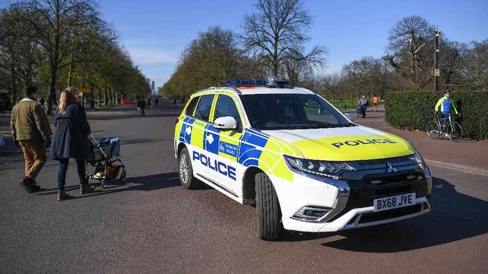 LONDON, ENGLAND  - MARCH 22: A Police car is seen parked at the gates to Greenwich Park on March 22, 2020 in London, United Kingdom. British Prime Minister Boris Johnson urged that people dont visit their parents this Mothering Sunday to curb the spread of COVID-19, which has killed 233 people in the UK.  (Photo by Peter Summers/Getty Images)