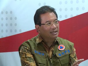 Pemerintah: Warga Pakai Masker Kain, Masker Medis Perlu Tempat Sampah Khusus