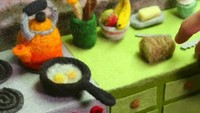 Jika tadi Andrea membuat animasi stop motion tutorial masak pasta, kini ia membuat animasi saat bikin menu sarapan. Ada telur mata sapi dan satu buah roti. Foto: Instagram @andreaanimates