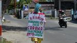 Aksi Badut Keliling Palu Ajak Warga Cegah Corona