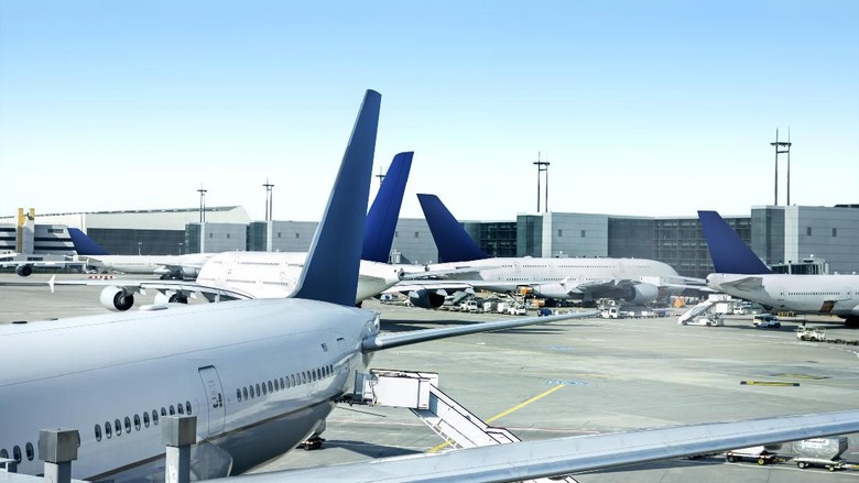 Airplanes side by side in airport