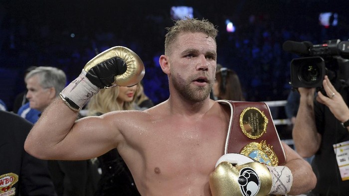 FILE - In this Dec. 16, 2017, file photo, Billy Joe Saunders, of Britain, celebrates his win over David Lemieux, of Canada, to retain the WBO middleweight boxing title in Laval, Quebec. Saunders had his boxing license suspended Monday, March 30, 2020, after publishing a social media video in which he appeared to condone domestic violence amid the coronavirus outbreak. He has apologized for his remarks, saying: “It was a silly mistake but I didnt mean to cause any harm to anyone and I certainly wouldnt promote domestic violence.”(Ryan Remiorz/The Canadian Press via AP)