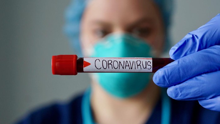virus corona Nurse wearing respirator mask holding a positive blood test result for the new rapidly spreading Coronavirus, originating in Wuhan, China