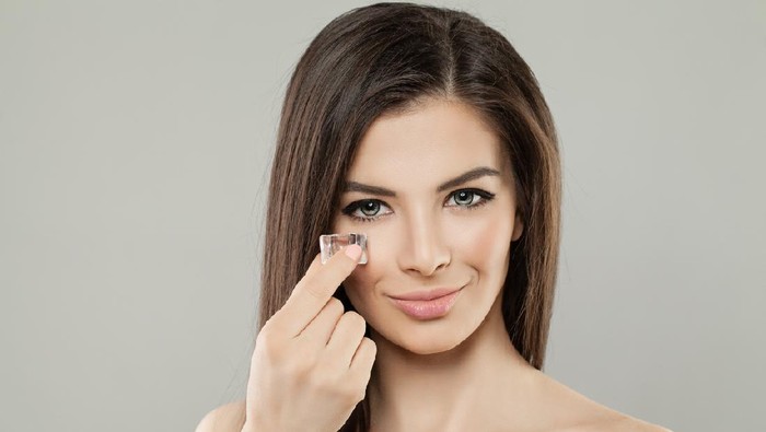 Beauty Female Face. Healthy Woman Face Close Up. Girl with Ice Cube