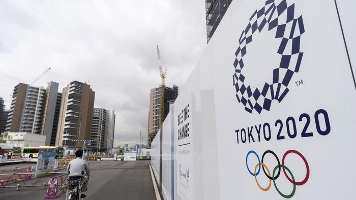 TOKYO, JAPAN - JULY 24: A worker rides a bicycle through the Olympic and Paralympic Village under construction on July 24, 2019 in Tokyo, Japan. (Photo by Tomohiro Ohsumi/Getty Images)