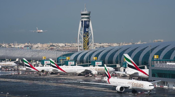 CORRECTS TO SAY THAT EMIRATES HAS DRAMATICALLY CUT ITS PASSENGER FLIGHT DESTINATIONS AND NOT SUSPENDED ALL FLIGHTS. -- FILE - In this Dec. 11, 2019 file photo, an Emirates jetliner comes in for landing at Dubai International Airport in Dubai, United Arab Emirates. On Sunday, March 22, 2020, long-haul carrier Emirates it has dramatically cut its passenger flight destinations from 145 locations to just 13 countries. (AP Photo/Jon Gambrell, File)