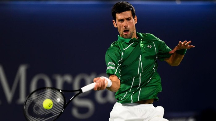 DUBAI, UNITED ARAB EMIRATES - FEBRUARY 29: Novak Djokovic of Serbia plays a forehand during his mens final match against Stefanos Tsitsipas of Greece on Day 13 of the Dubai Duty Free Tennis at Dubai Duty Free Tennis Stadium on February 29, 2020 in Dubai, United Arab Emirates (Photo by Tom Dulat/Getty Images)