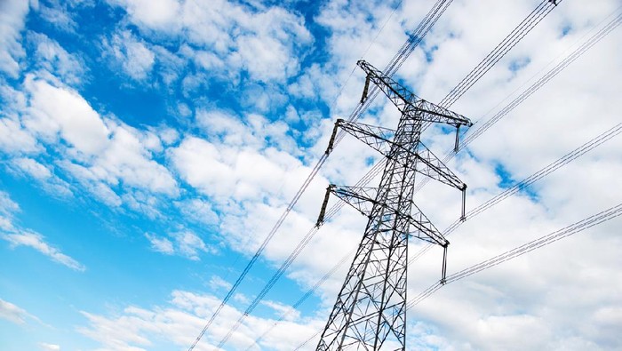 Electricity pylons under the blue sky