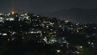 Begini suasana di Kota Kohima saat warganya mematikan lampu dan menyalakan lilin. AP Photo/Yirmiyan Arthur.