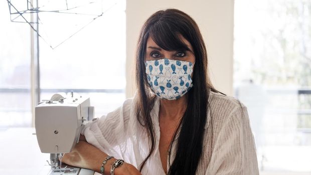 Women sewing protective mask, Quebec, Canada