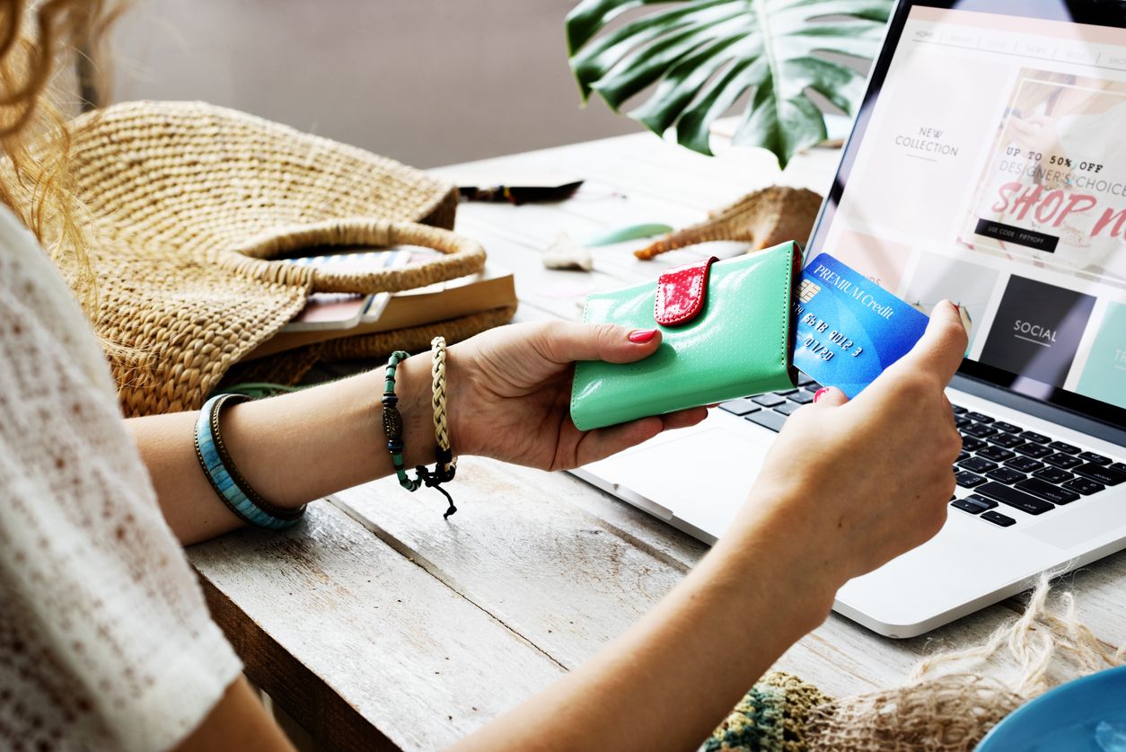 Shopping online concept - Shopping service on The online web. with payment by credit card and offers home delivery. parcel or Paper cartons with a shopping cart logo on a laptop keyboard