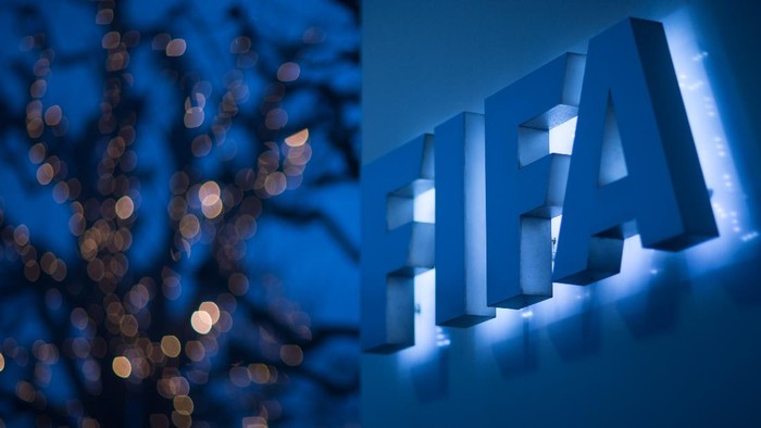 ZURICH, SWITZERLAND - DECEMBER 03: An illuminated FIFA logo sits on a sign at the FIFA headquarters on December 3, 2015 in Zurich, Switzerland. (Photo by Philipp Schmidli/Getty Images)
