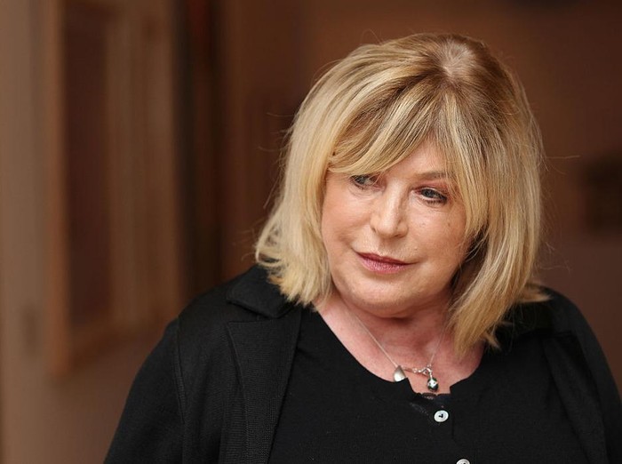 LIVERPOOL, ENGLAND - APRIL 20:  Singer-songwriter Marianne Faithfull poses next to artworks as she opens the Innocence And Experience exhibition at Tate Liverpool on April 20, 2012 in Liverpool, England. Marianne Faithfull is the latest co-curator in the acclaimed DLA Piper Series at Tate Liverpool where she worked with the curatorial team to select works from the Tate Collection for a new display.  (Photo by Christopher Furlong/Getty Images)