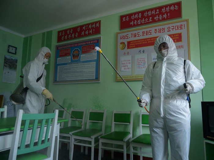 Health officials disinfect an office room amid concerns over the COVID-19 coronavirus at the Pyongchon District Peoples Hospital in Pyongyang on April 1, 2020. (Photo by KIM Won Jin / AFP) (Photo by KIM WON JIN/AFP via Getty Images)