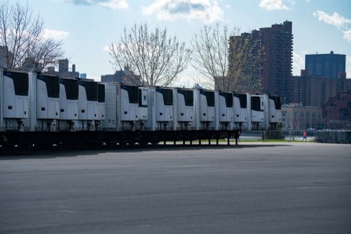 NEW YORK, NY - APRIL 08: Randall's Island has fifty refrigerated trucks and a crew of carpenters building shelves for the expected influx of deaths related to COVID-19 pandemic on April 8, 2020 in New York City. The trucks will be able to house an estimated 2,500 of the dead as city morgues reach capacity. New York state has nearly 150,000 of the nation's confirmed cases of COVID-19, including more than 6,000 dead.   David Dee Delgado/Getty Images/AFP