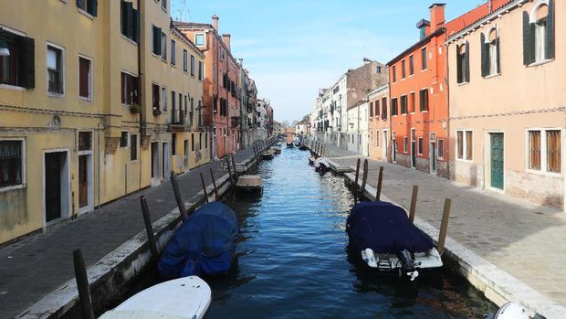 VENICE, ITALY - MARCH 9: A canal and the roads next to it are seen completely empty on March 9, 2020 in Venice, Italy. Prime Minister Giuseppe Conte announced a 