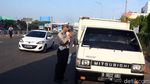 Petugas Pantau Check Point PSBB di Pintu Tol Bekasi Barat