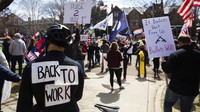 Pendemo meneriakkan yel-yel menolak stay at home. Minnesota Public Radio via AP/Evan Frost.