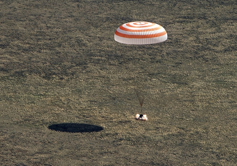 In this handout photo released by Gagarin Cosmonaut Training Centre (GCTC), Roscosmos space agency, U.S. astronauts Andrew Morgan, left, Jessica Meir, right, and Russian cosmonaut Oleg Skripochka sit in chairs shortly after the landing of the Russian Soyuz MS-15 space capsule near Kazakh town of Dzhezkazgan, Kazakhstan, Friday, April 17, 2020. An International Space Station crew has landed safely after more than 200 days in space. The Soyuz capsule carrying NASA astronauts Andrew Morgan, Jessica Meir and Russian space agency Roscosmos' Oleg Skripochka touched down on Friday on the steppes of Kazakhstan. (Andrey Shelepin, Gagarin Cosmonaut Training Centre (GCTC), Roscosmos space agency, via AP)