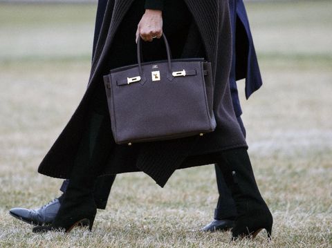 President Donald Trump and first lady Melania Trump, carrying a Hermes handbag, walk to Marine One across the South Lawn of the White House in Washington, Friday, Feb. 15, 2019, for the short trip to Andrews Air Force Base en route to Palm Beach International Airport, in West Palm Beach, Fla., then to Mar-a-Lago. (AP Photo/Carolyn Kaster)