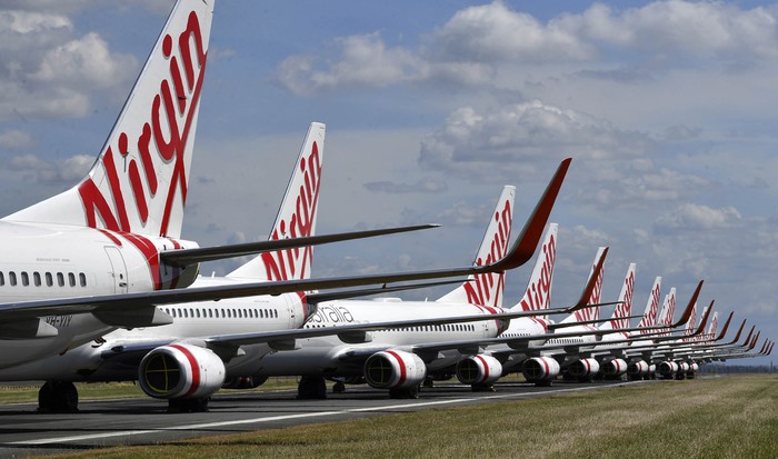 Maskapai Virgin Australia kolaps akibat pandemi Corona. Saat ini, banyak armada Virgin yang dikandangkan.