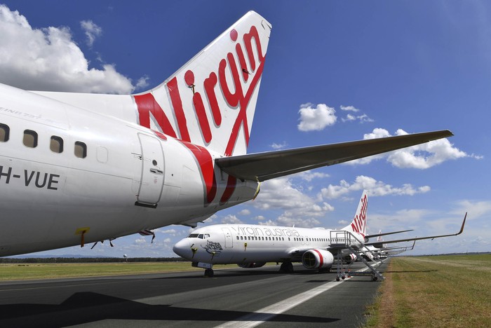 Maskapai Virgin Australia kolaps akibat pandemi Corona. Saat ini, banyak armada Virgin yang dikandangkan.