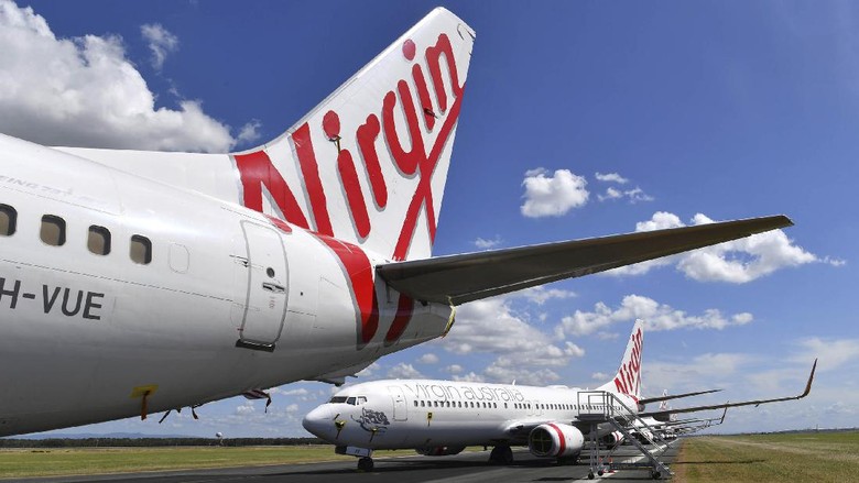 Virgin Australia Ngandang Gegara Corona Maskapai Virgin Australia kolaps akibat pandemi Corona. Saat ini, banyak armada Virgin yang dikandangkan.