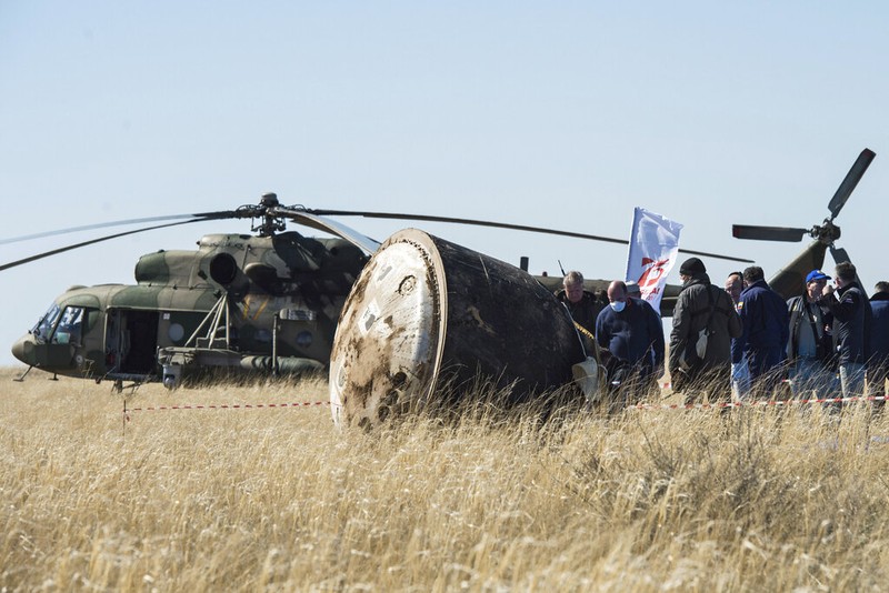 In this handout photo released by Gagarin Cosmonaut Training Centre (GCTC), Roscosmos space agency, U.S. astronauts Andrew Morgan, left, Jessica Meir, right, and Russian cosmonaut Oleg Skripochka sit in chairs shortly after the landing of the Russian Soyuz MS-15 space capsule near Kazakh town of Dzhezkazgan, Kazakhstan, Friday, April 17, 2020. An International Space Station crew has landed safely after more than 200 days in space. The Soyuz capsule carrying NASA astronauts Andrew Morgan, Jessica Meir and Russian space agency Roscosmos' Oleg Skripochka touched down on Friday on the steppes of Kazakhstan. (Andrey Shelepin, Gagarin Cosmonaut Training Centre (GCTC), Roscosmos space agency, via AP)