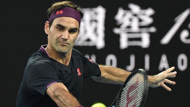 Novak Djokovic FILE - In this Thursday, Jan. 30, 2020 file photo, Switzerland's Roger Federer makes a backhand return to Serbia's Novak Djokovic during their semifinal match at the Australian Open tennis championship in Melbourne, Australia. Roger Federer offered stuck-at-home amateurs the ultimate online fantasy camp, a chance to get tennis tips from a GOAT. While people all over the world are cooped up because of the new coronavirus -- social distancing while trying to stay healthy and help others do the same -- a bunch of athletes have been posting workouts and drills on social media with suggestions for staying in shape. Federer did that sort of thing, too, on Tuesday, April 7, 2020. (AP Photo/Andy Brownbill, File)
