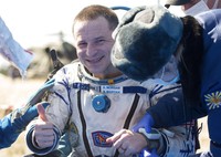In this handout photo released by Gagarin Cosmonaut Training Centre (GCTC), Roscosmos space agency, U.S. astronauts Andrew Morgan, left, Jessica Meir, right, and Russian cosmonaut Oleg Skripochka sit in chairs shortly after the landing of the Russian Soyuz MS-15 space capsule near Kazakh town of Dzhezkazgan, Kazakhstan, Friday, April 17, 2020. An International Space Station crew has landed safely after more than 200 days in space. The Soyuz capsule carrying NASA astronauts Andrew Morgan, Jessica Meir and Russian space agency Roscosmos Oleg Skripochka touched down on Friday on the steppes of Kazakhstan. (Andrey Shelepin, Gagarin Cosmonaut Training Centre (GCTC), Roscosmos space agency, via AP)