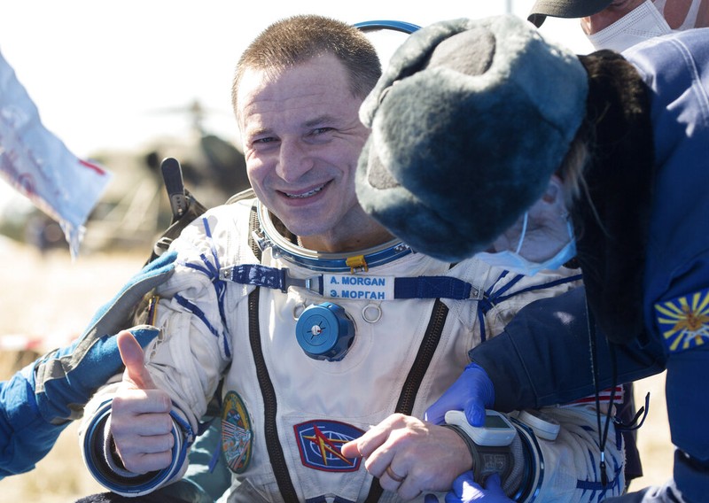 In this handout photo released by Gagarin Cosmonaut Training Centre (GCTC), Roscosmos space agency, U.S. astronauts Andrew Morgan, left, Jessica Meir, right, and Russian cosmonaut Oleg Skripochka sit in chairs shortly after the landing of the Russian Soyuz MS-15 space capsule near Kazakh town of Dzhezkazgan, Kazakhstan, Friday, April 17, 2020. An International Space Station crew has landed safely after more than 200 days in space. The Soyuz capsule carrying NASA astronauts Andrew Morgan, Jessica Meir and Russian space agency Roscosmos' Oleg Skripochka touched down on Friday on the steppes of Kazakhstan. (Andrey Shelepin, Gagarin Cosmonaut Training Centre (GCTC), Roscosmos space agency, via AP)