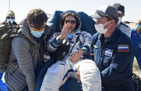 In this handout photo released by Gagarin Cosmonaut Training Centre (GCTC), Roscosmos space agency, U.S. astronauts Andrew Morgan, left, Jessica Meir, right, and Russian cosmonaut Oleg Skripochka sit in chairs shortly after the landing of the Russian Soyuz MS-15 space capsule near Kazakh town of Dzhezkazgan, Kazakhstan, Friday, April 17, 2020. An International Space Station crew has landed safely after more than 200 days in space. The Soyuz capsule carrying NASA astronauts Andrew Morgan, Jessica Meir and Russian space agency Roscosmos Oleg Skripochka touched down on Friday on the steppes of Kazakhstan. (Andrey Shelepin, Gagarin Cosmonaut Training Centre (GCTC), Roscosmos space agency, via AP)